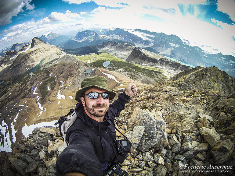 Hiker on summit, selfie on mountain tip Hiker on summit, selfie on mountain tip