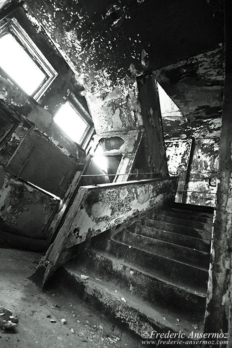 Burnt stairway in abandoned building in Quebec, Ste Clotilde Asylum