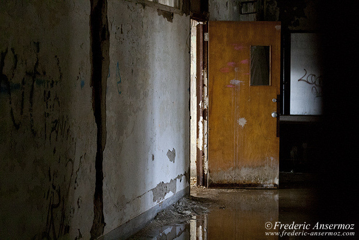 Light coming from a door in a dark corridor, urban exploration