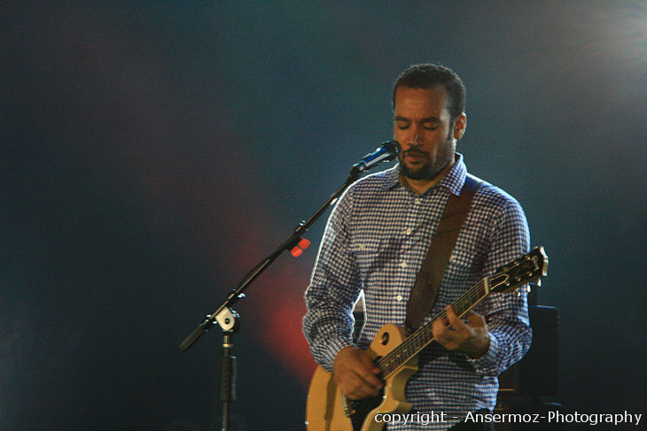 Ben Harper plays guitar at Montreal Jazz Festival