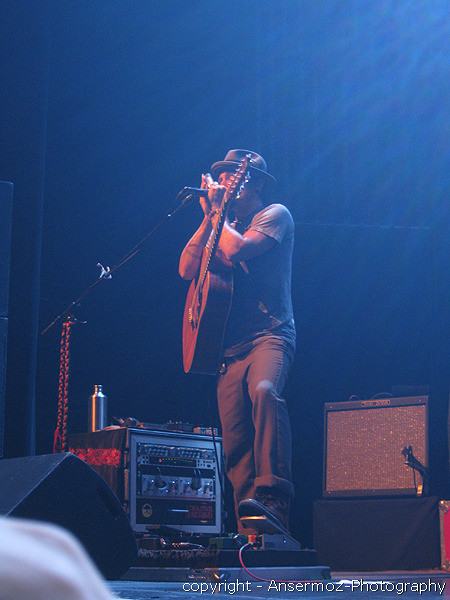 John Butler in Montreal playing harmonica